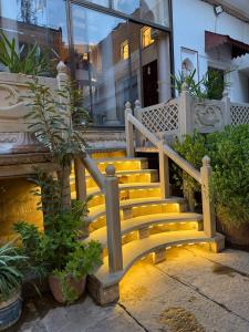 a set of stairs with a bench in front of a building at Rudreshwar Mahadeo Kothi in Varanasi