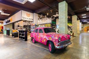 a pink truck is parked in a mall at Dashli Gala Hotel Ganja in Ganja