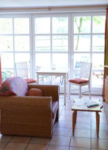 a living room with a couch and a table at Landhaus am Esch in Warendorf