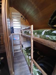 a couple of bunk beds in a room at La Colline Aux Cabanes in Espaly-Saint-Marcel