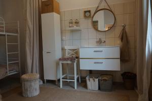 a bathroom with a sink and a mirror at Thula - Apartment in Villa Ambrosian in Trzebież +42 photos