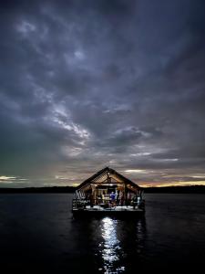 a house on a dock in a body of water at Krabi Floating Glamping in Ban Khlong Khae (2)