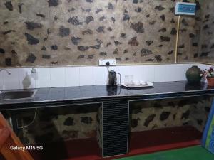 a kitchen with a counter with a tea kettle on it at Gleanloch Holiday Resort in Tawalantenna