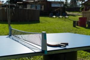 a hat sitting on top of a ping pong table at Quintinha de Sá in Arnoso