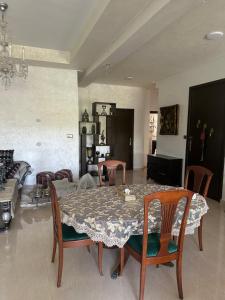 a living room with a table and chairs at Séjour chez habitant in Rabat +5 photos