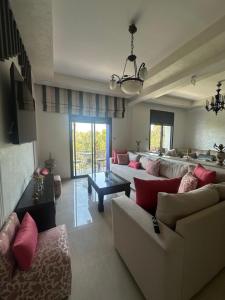 a large living room with couches and a table at Séjour chez habitant in Rabat