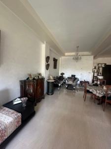 a living room with a couch and a table at Séjour chez habitant in Rabat