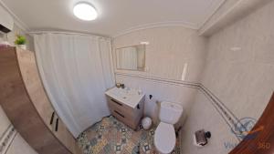 a small bathroom with a sink and a toilet at casadelsol in Caravaca de la Cruz +8 photos