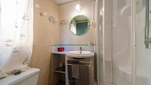 a bathroom with a sink and a shower and a mirror at Elba Travels in Capoliveri +61 photos