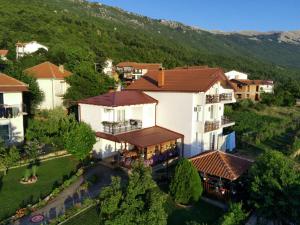 an aerial view of a building in a village at Shoposki Guest House in Ohrid