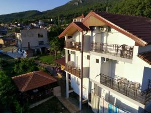 an aerial view of a white building with balconies at Shoposki Guest House in Ohrid