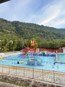 a large swimming pool with a water park at Malokas Resort - El Socorro - San Gil in Socorro