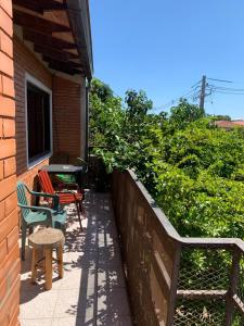a patio with chairs and a table next to a building at Habitación 4 in Asunción