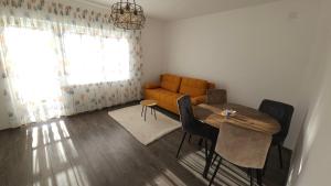 a living room with a couch and a table at Villa Ruscello in Grabovac