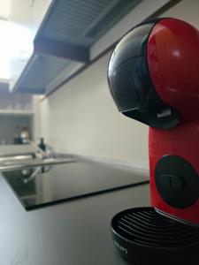 a red blender sitting on a counter in a kitchen at Residenza 404 in Ivrea