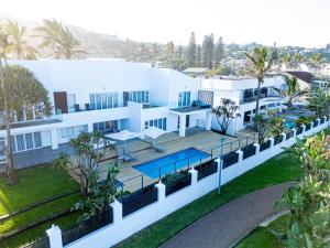 an aerial view of a white house with a swimming pool at Vetho House Villa Ballito in Ballito