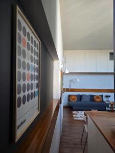 a living room with a painting on the wall at Residenza 402 in Ivrea