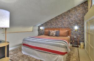 a bedroom with a bed in a room at Tamarron Lodge Loft 510 in Durango +37 photos