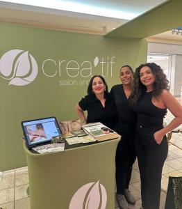 three women standing next to a counter in a store at La Posadita in Carolina