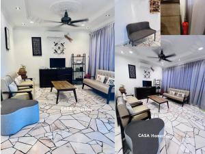 a living room with a couch and chairs and a table at CASA Homestay in Batu Pahat
