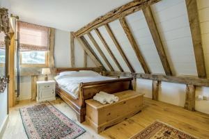 a small bedroom with a bed and a window at Unique Luxury Barn in Tenbury