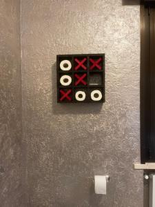 a wall with a box with four rolls of tape at casa TRE19 in Mantova