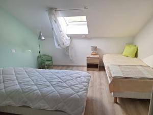 a bedroom with a large bed and a window at Le gîte Bellevue in Firmi