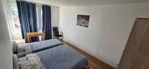 a bedroom with a bed and a window at Boka Bay in Tivat