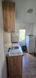 a kitchen with a sink and a counter top at Boka Bay in Tivat