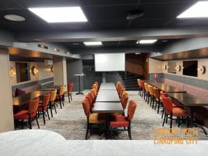 a dining room with tables and chairs in a room at Comfort Hotel Linköping City in Linköping
