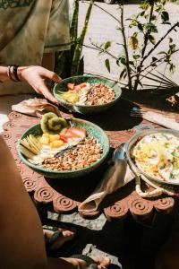 a table with three plates of food on it at NOUR Tamraght in Tamraght Ouzdar +33 photos