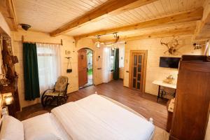 a living room with a white couch and a table at Alashkert Guesthouse Premium and Cozy Studios in Gyumri in Gyumri