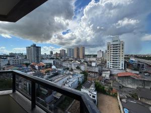 a view of a city from a balcony at Flat Jardim de Allah in Campos dos Goytacazes