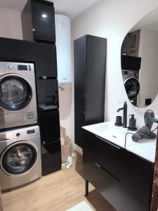 a bathroom with a washer and a sink and a washing machine at Imperial Rabat - MAKE IT YOURS in Rabat +20 photos