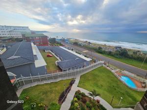 an aerial view of a building and the ocean at Ocean Whisper 405 in Scottburgh