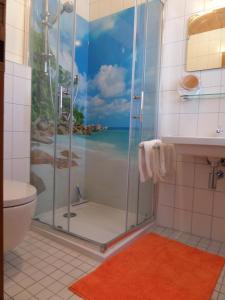 a bathroom with a shower with a view of the ocean at Lehnhäusl Aschauer in Berchtesgaden +39 photos