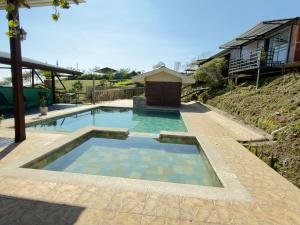 a swimming pool in the middle of a house at Paulos View Lodge in Colonia +38 photos