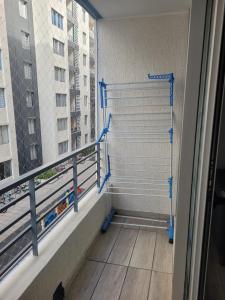 a balcony with a view of a building at Depto Comodo y full equipado in Antofagasta