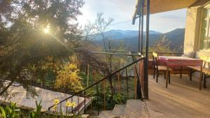 a balcony of a house with a view of the mountains at Vamesa in Haghpat
