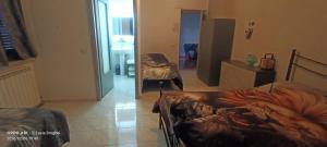 a room with two beds in a room with a hallway at King of the road in Ceprano