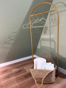 a basket of towels sitting on the floor in a room at Alpin Chalet & SPA in Mănăstirea Humorului