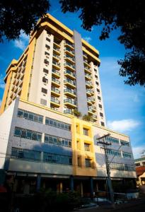 a tall building with a lot of windows at Aquarius Flat 510 in Santa Cruz do Sul