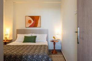 a bedroom with a bed in a room at Vrachos Nature Lodges Thyme 1, Private pool in Agia Galini +34 photos