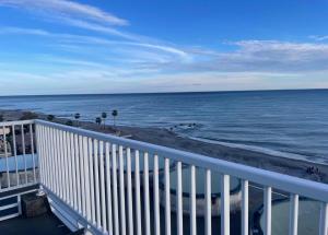 a view of the ocean from a balcony at El mar in Ventimiglia
