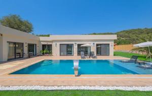 a swimming pool in the backyard of a house at villa tera Private Pool & jacuzzi in Fethiye