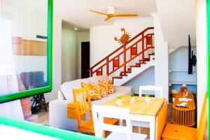 a living room with a white couch and a table at Muellito de Famara in Famara