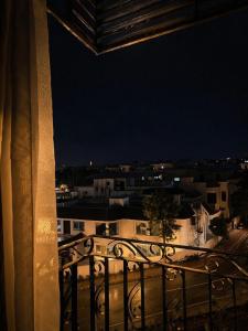 a view of a city at night from a balcony at Maison Veyra in Rawalpindi