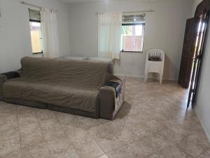 a living room with a couch and a table at Paraíso do Abais, house for rent in Estância