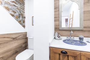 a bathroom with a sink and a mirror at Rincón de Hada in Mojácar +15 photos