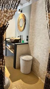 a bathroom with a sink and a mirror on the wall at Café Gili Beach Bungalows in Gili Meno +27 photos